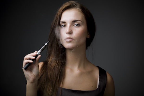 woman smoking vape pen